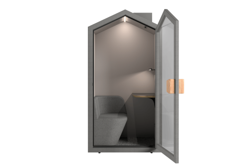 Интериор на акустична кабина Cottage Pod с вграден диван, регулируема работна маса и LED осветление 4000K